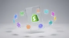 Die besten Shopify Apps 2026 – Glassmorphism-Tablet mit Shopify App Store und bunten App-Icons